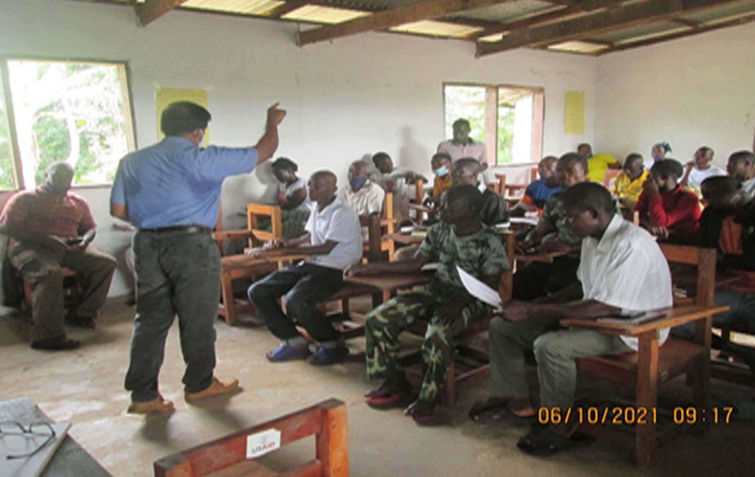 Nursery maintenance training at Cinta, Margibi County involving 43 farmers. Firestone Farm Advisory Manager, Mr. Nirmal Paily, facilitates.